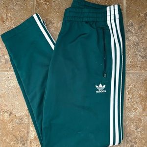 Green adidas track pants
